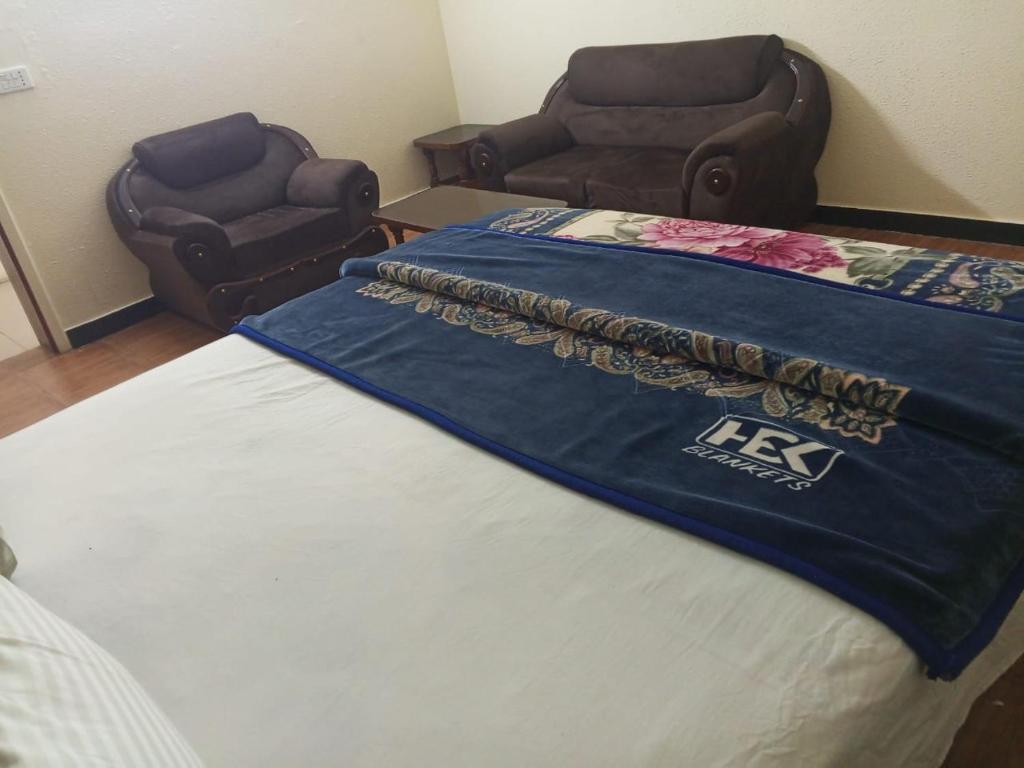 Giường trong phòng chung tại Hotel Eleven J