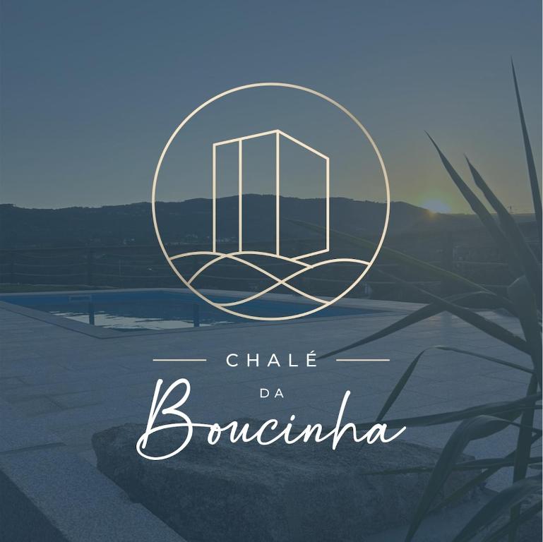 a sign that reads chalky da bournania with a picture of a book at Chalé da Boucinha in Celorico de Basto