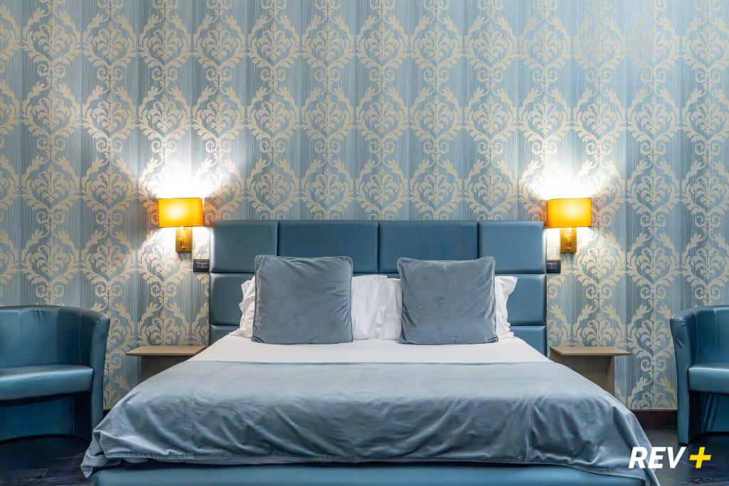 En eller flere senge i et værelse på Via Veneto Suites