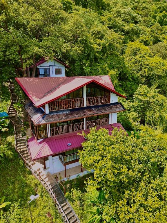 an overhead view of a house with a red roof at CED Garden in El Nido