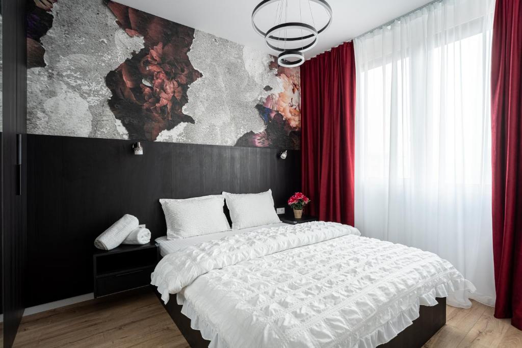 En eller flere senge i et værelse på Sika Diplomat Apartment