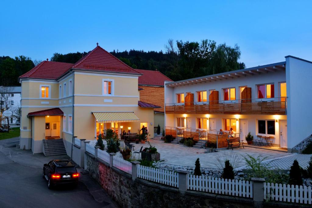 a house with a car parked in front of it at Pension Gambrinus in Passau