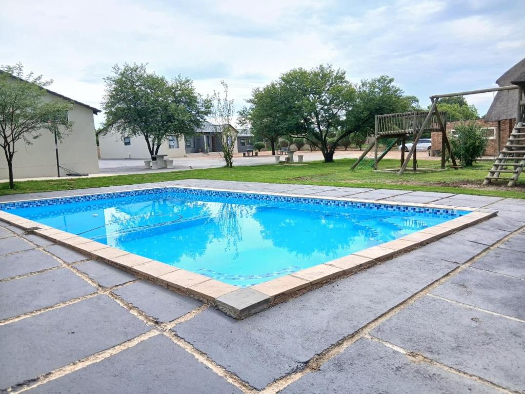 Bazén v ubytování Bossi Lodge nebo v jeho okolí