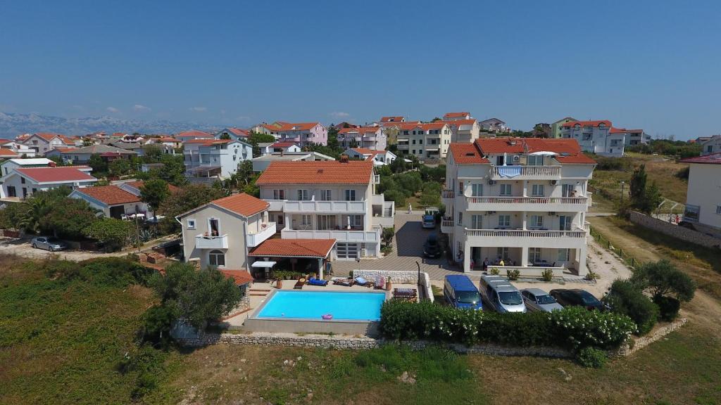 an aerial view of a house with a swimming pool at Villa Jurac in Povljana