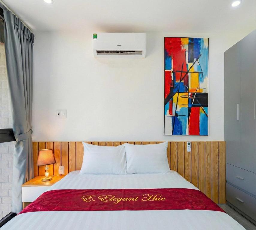 En eller flere senge i et værelse på The Elegant Boutique - Hue