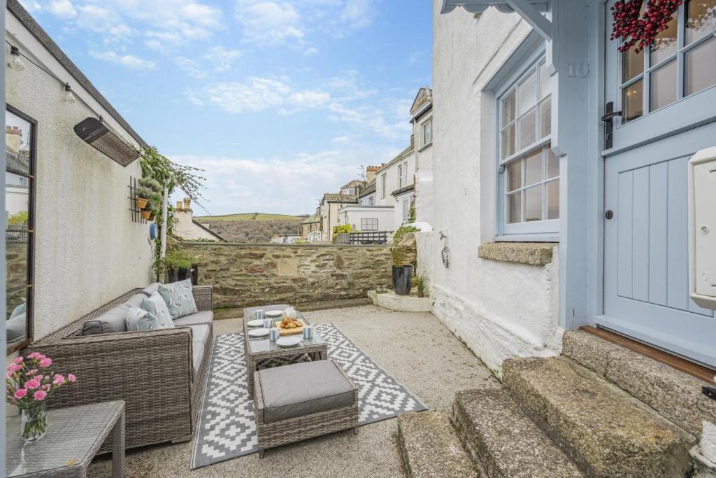 a small patio with a couch and a table at 2 Bed in Fowey oc-r30265 in Fowey