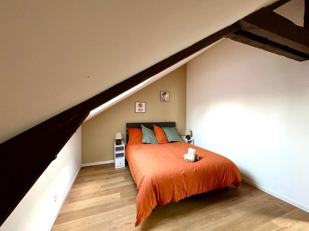 Postel nebo postele na pokoji v ubytování La Mansarde - Appartement cosy de 2 chambres