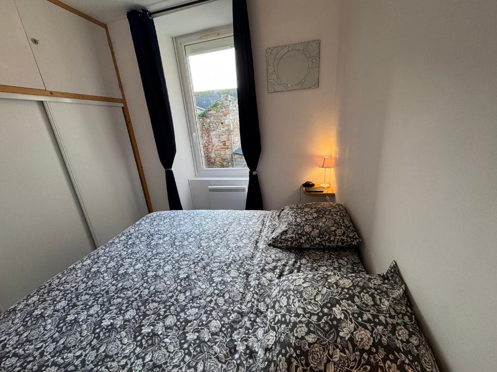 Ένα ή περισσότερα κρεβάτια σε δωμάτιο στο Les Flots du Quai