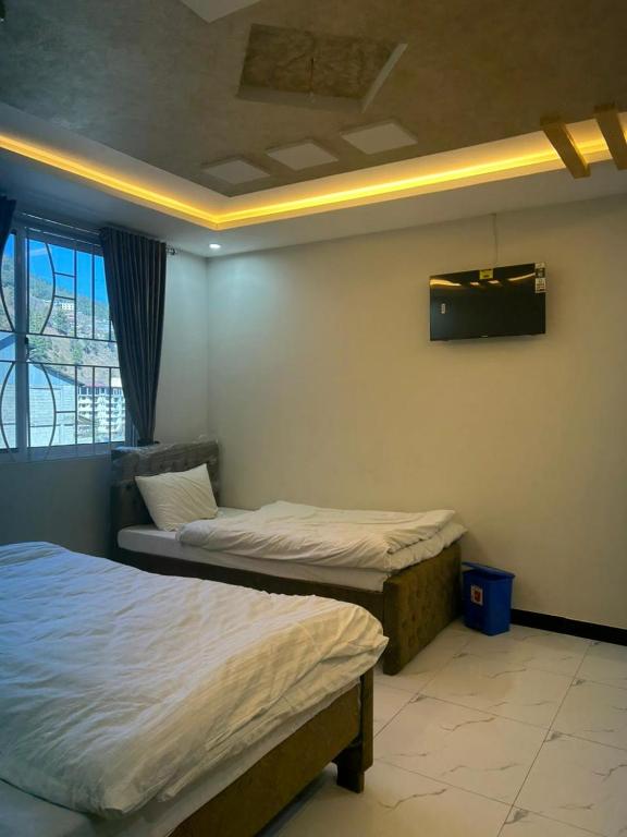 Postel nebo postele na pokoji v ubytování Murree Hotel Askari Lodges