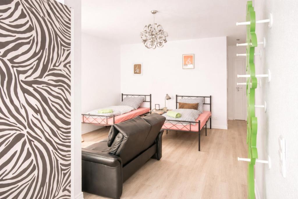 Postel nebo postele na pokoji v ubytování Brody Apartments - gemütlich wohnen nähe Büdingen