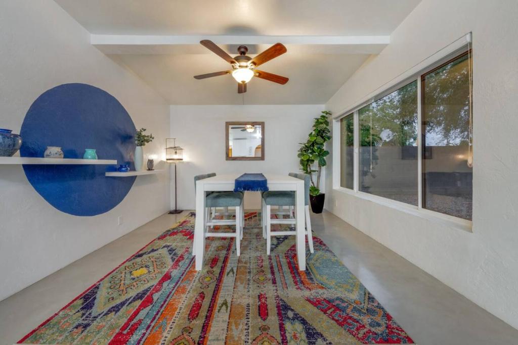 a dining room with a table and a ceiling fan at 24th St (Deepak & Jackie) in Tucson