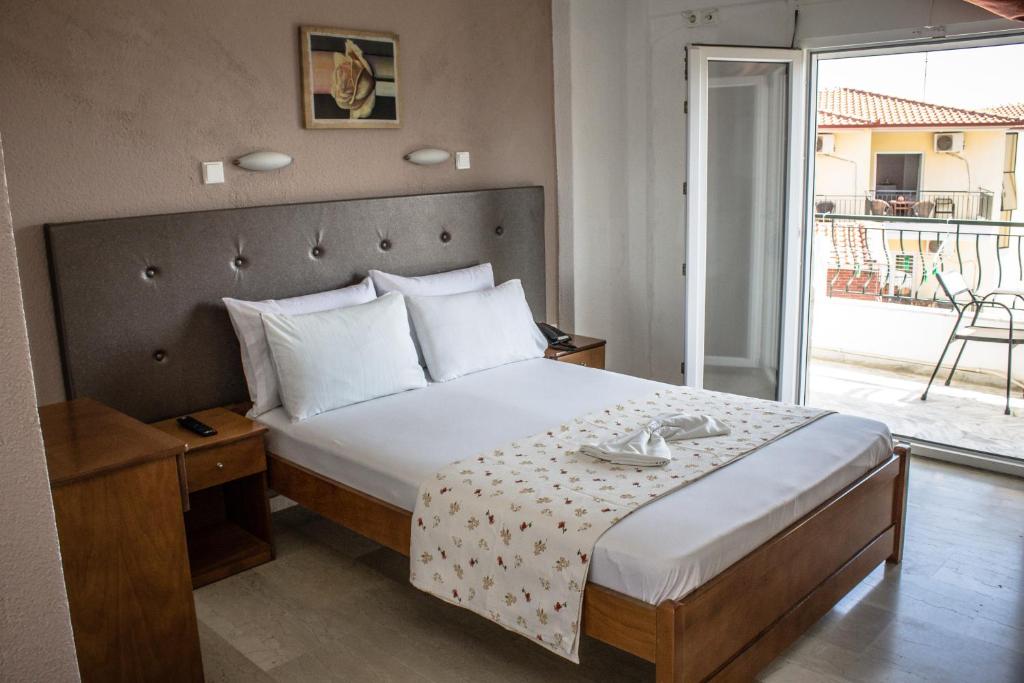 Posteľ alebo postele v izbe v ubytovaní Hotel Ilios