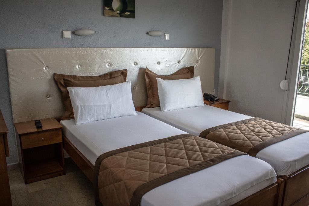 Posteľ alebo postele v izbe v ubytovaní Hotel Ilios