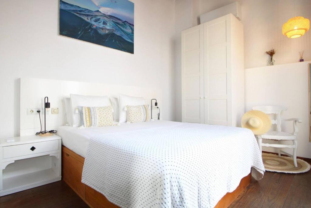 En eller flere senge i et værelse på Casa Trast