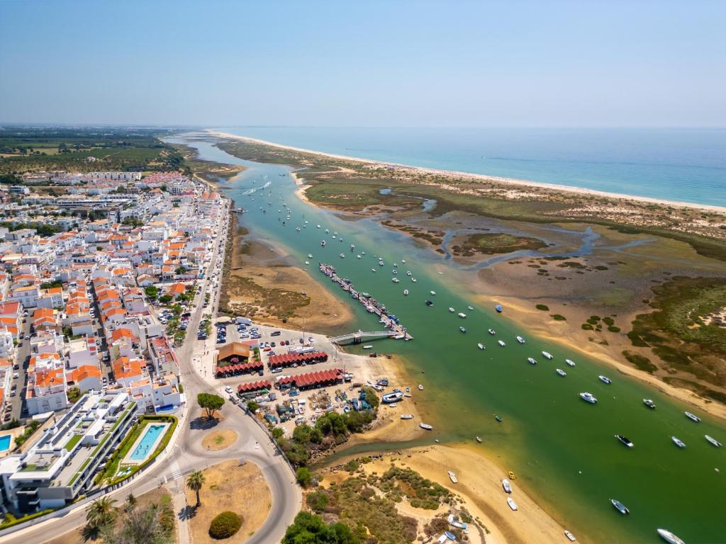 an aerial view of a beach and the ocean at Cabanas Beach T2 in Cabanas de Tavira