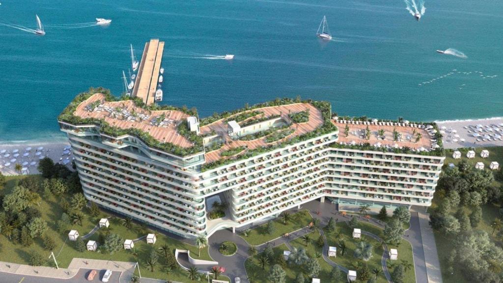 a hotel with an ivycovered roof on top of a building at bamboo beach in Buknari