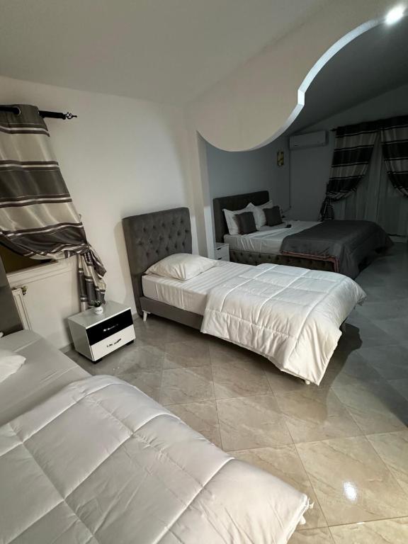 Postel nebo postele na pokoji v ubytování Résidence Les Camélias