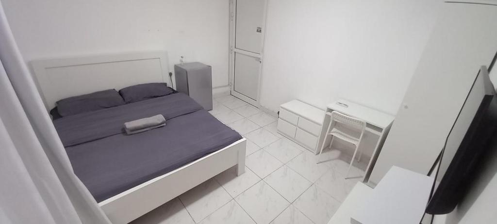 Giường trong phòng chung tại DIsnip Full Apartments