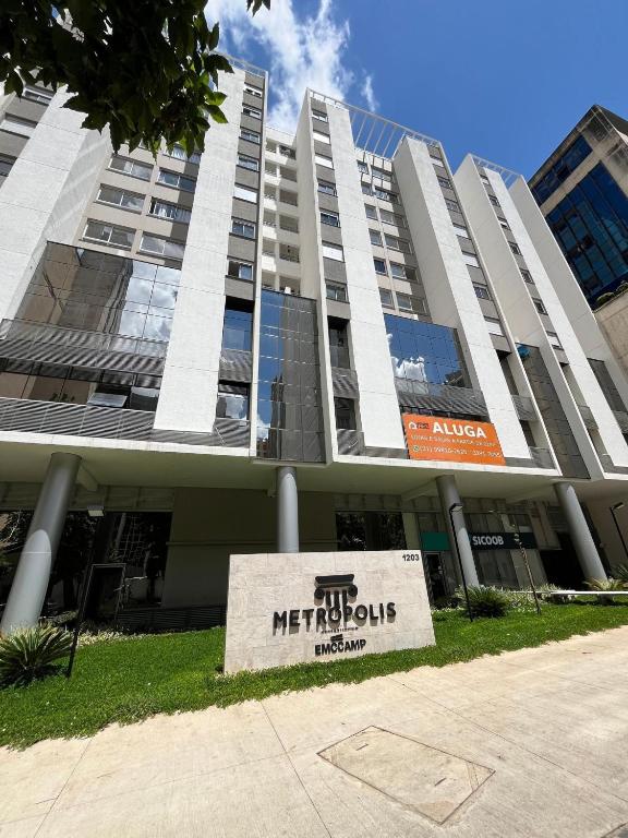 a building with a sign in front of it at LK Centro 55 in Belo Horizonte