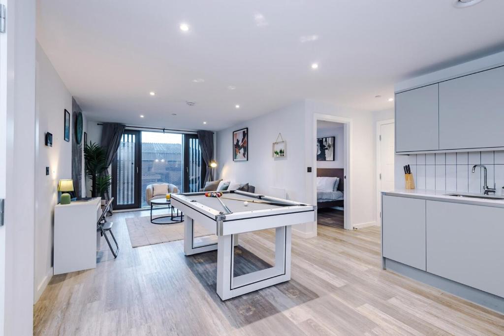 a kitchen and living room with a pool table at Birmingham City centre, Pool table, Spacious in Birmingham