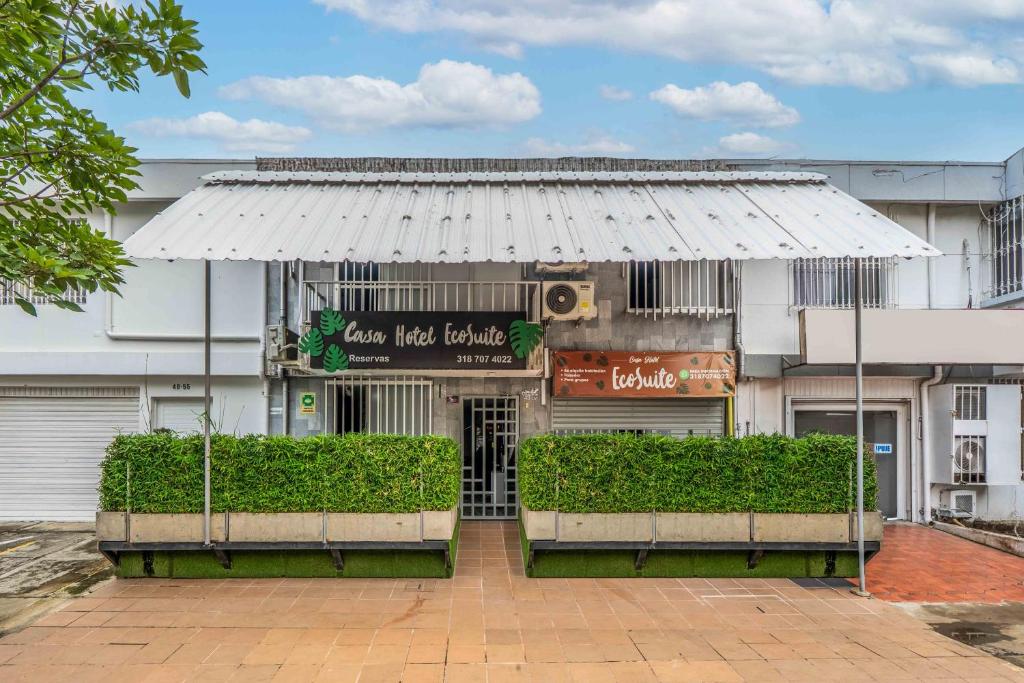 a building with a white awning in front of it at Casa Hotel Ecosuite in Cali