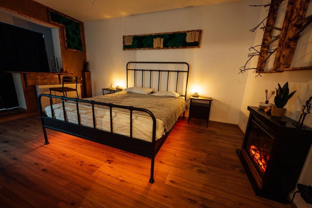 a bedroom with a bed and a fire place at Urban Escape Studio in Ploieşti