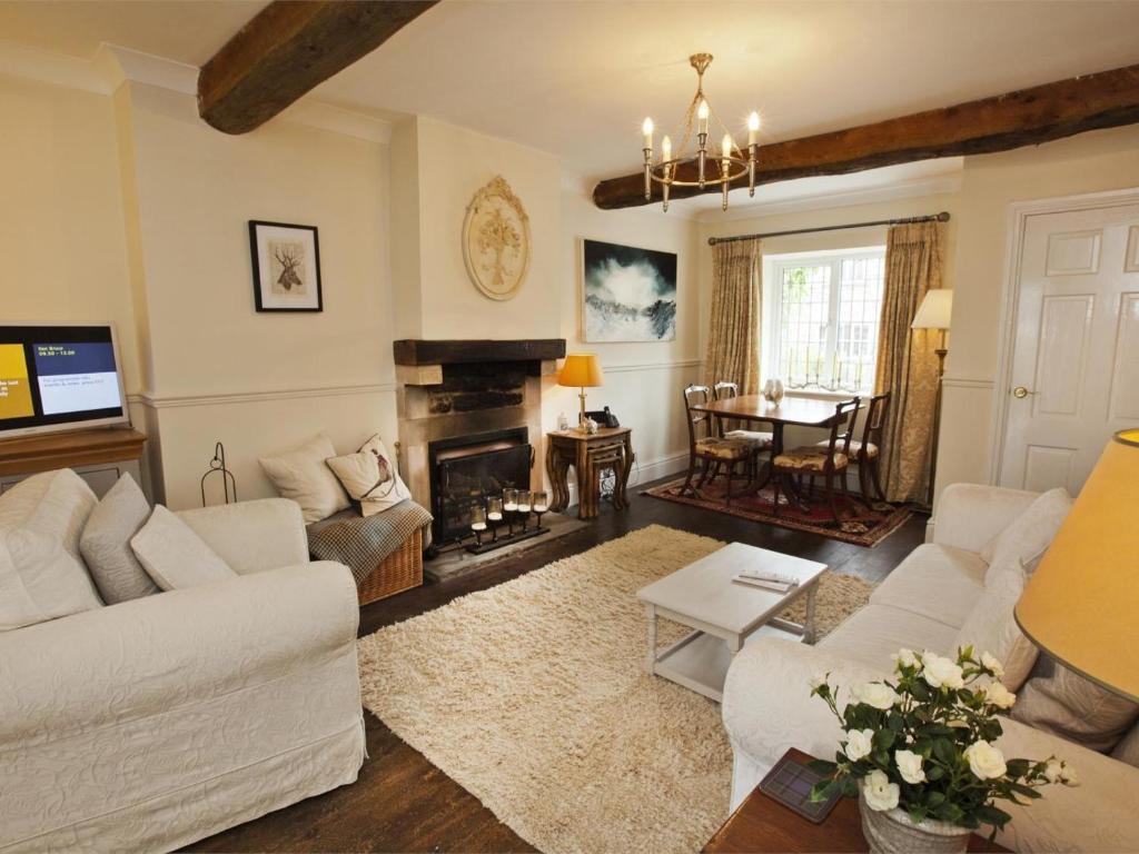 a living room with a couch and a fireplace at 2 Bed in Richmond oc-g0116 in Hutton Magna