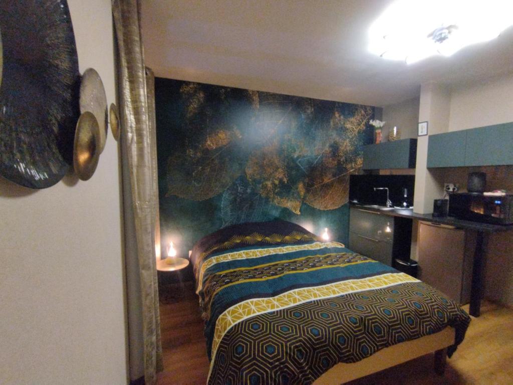 Ένα ή περισσότερα κρεβάτια σε δωμάτιο στο Bienvenue à Vinélys