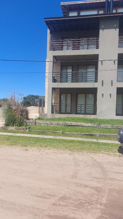 a building with a dirt road in front of it at dpto SanLuis in Valeria del Mar
