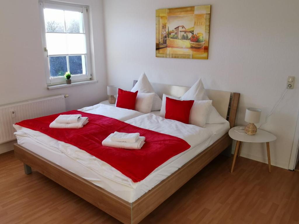 En eller flere senge i et værelse på Domizil Am Stadtzentrum