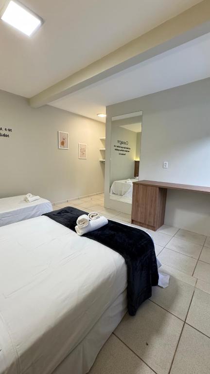 En eller flere senge i et værelse på Guest House Suite Renovo