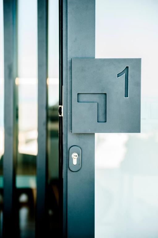 a metal door with the number on it at Suite Risco 1 in La Guancha