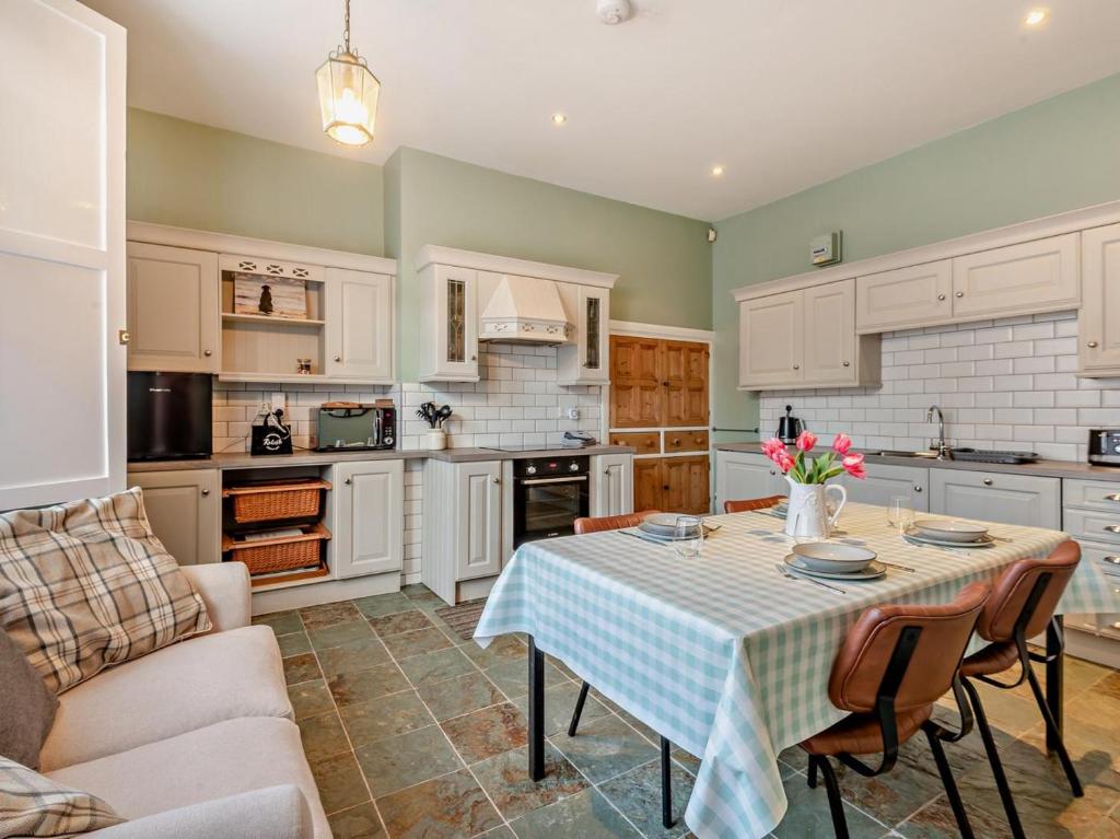 a kitchen with a table and a couch at 2 Bed in Ambleside oc-95914 in Hawkshead