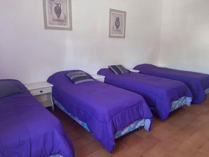 Giường trong phòng chung tại Complejo Ultramar