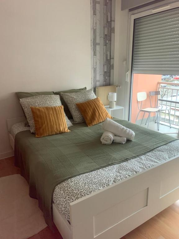 En eller flere senge i et værelse på Ma première étoile