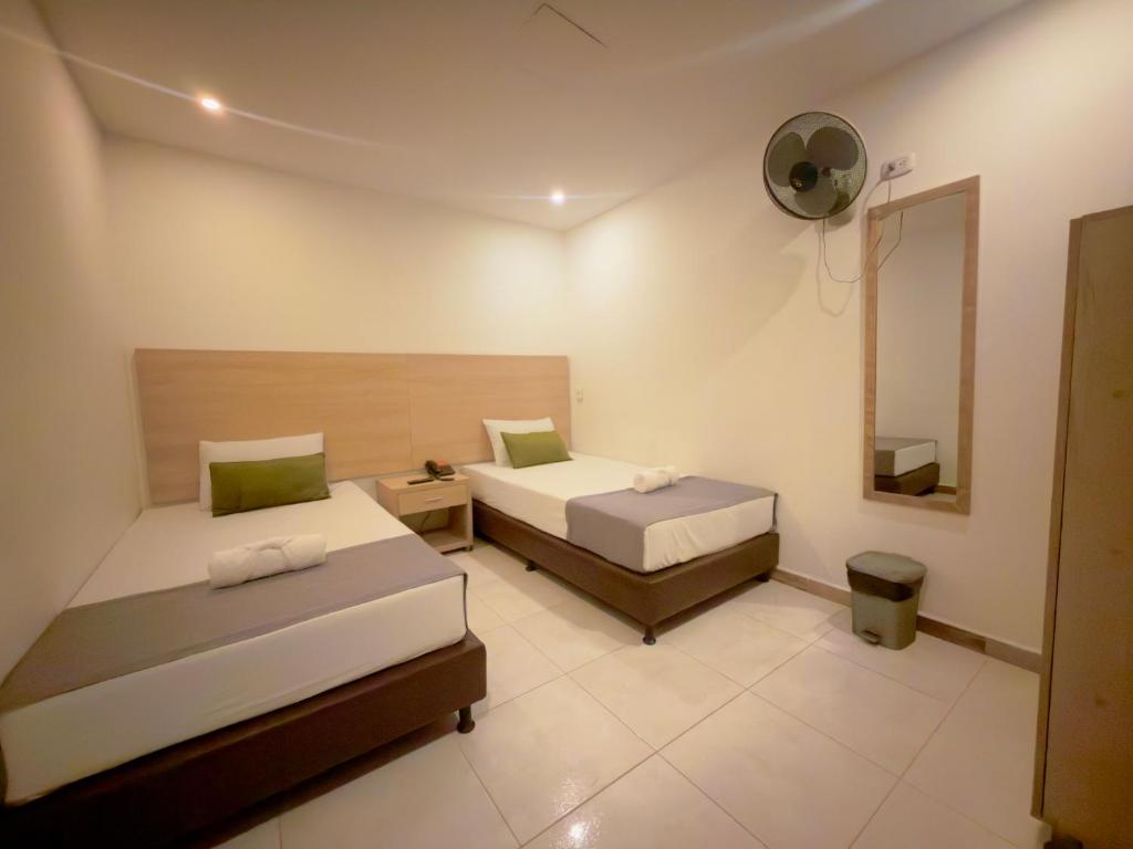 Postel nebo postele na pokoji v ubytování Hotel MOVA