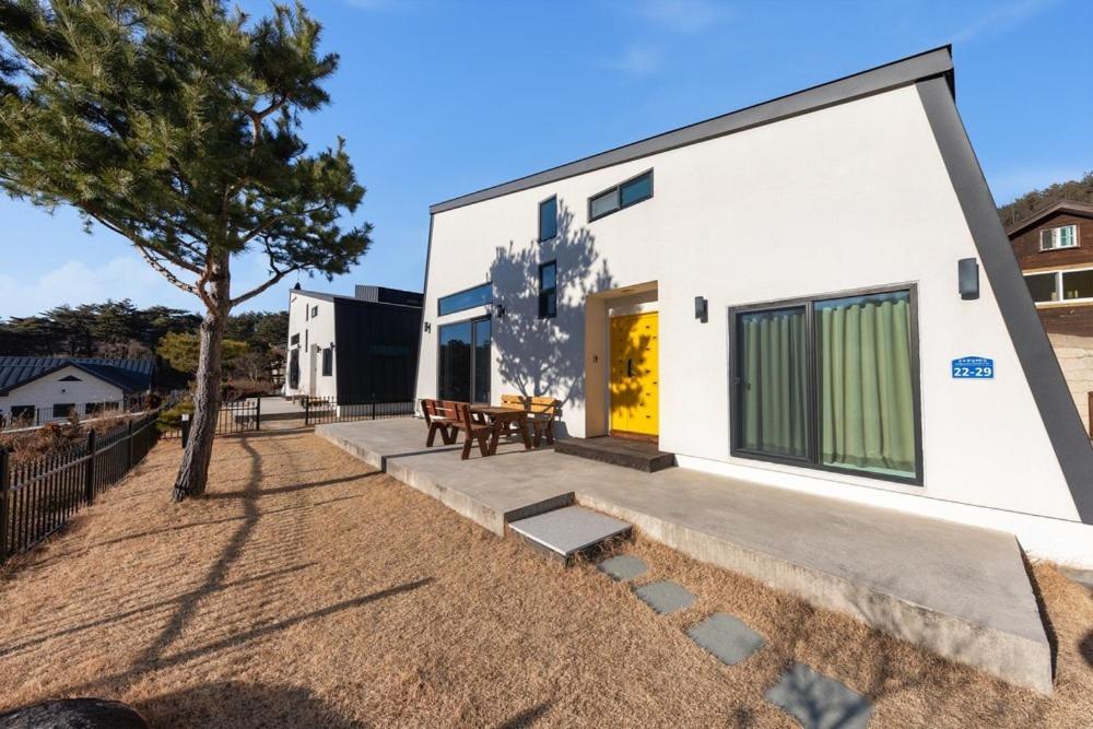 a modern house with a courtyard at Gangneung Solol Pension in Gangneung