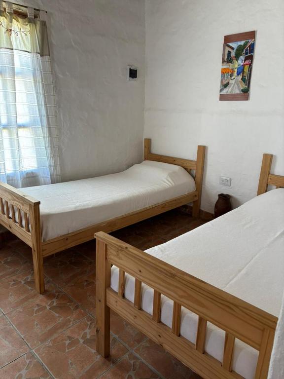 En eller flere senge i et værelse på El descanso