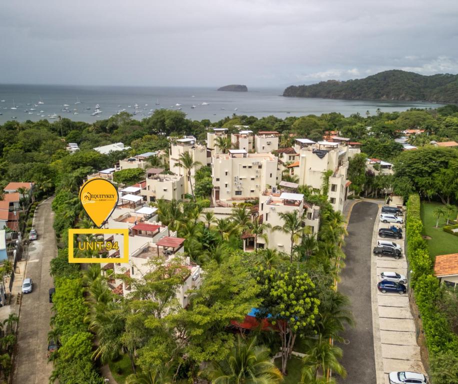 an aerial view of a city with houses and the ocean at Breezy Paradise 2 bed2bath with mountain view in Coco