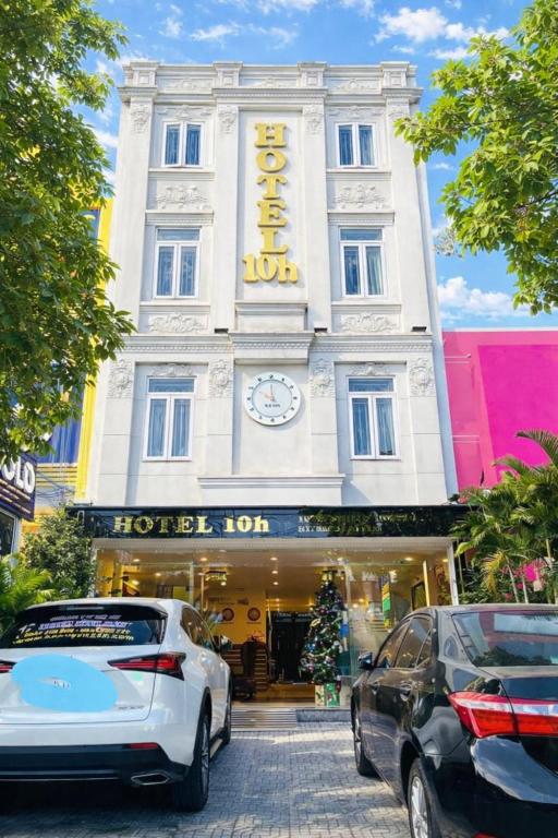 two cars parked in front of a hotel room at 10h Hotel in Ho Chi Minh City