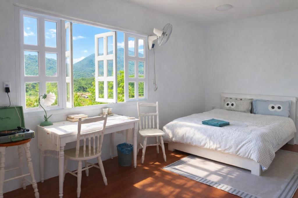 Postel nebo postele na pokoji v ubytování HCA Homestay