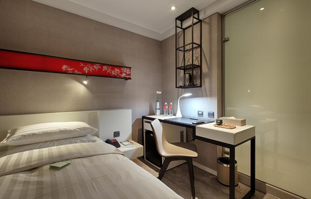 Postel nebo postele na pokoji v ubytování City Place Hotel