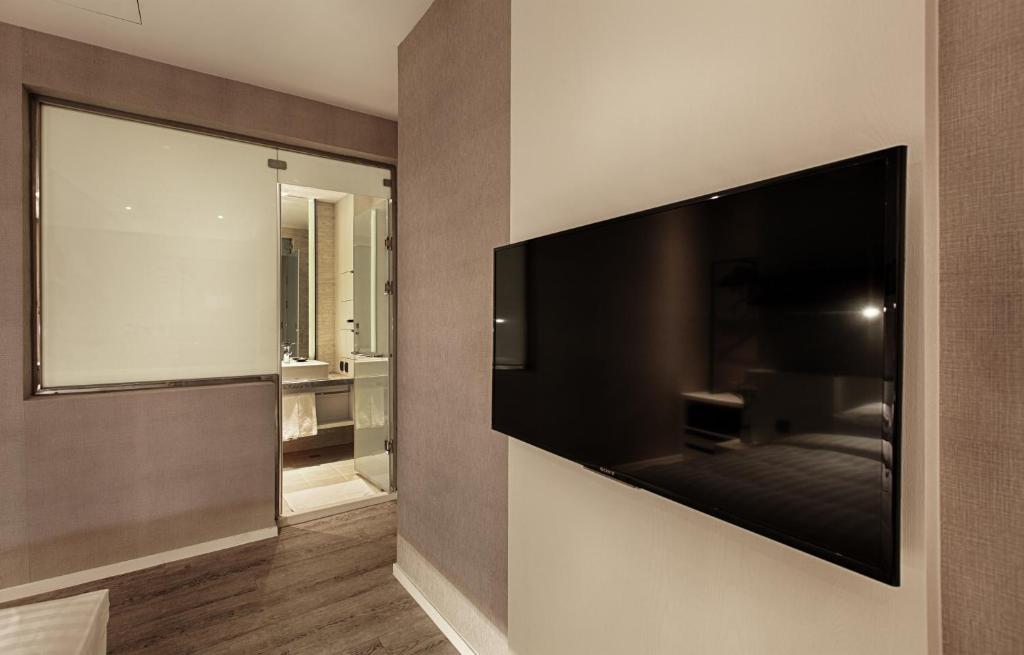 TV a/nebo společenská místnost v ubytování City Place Hotel