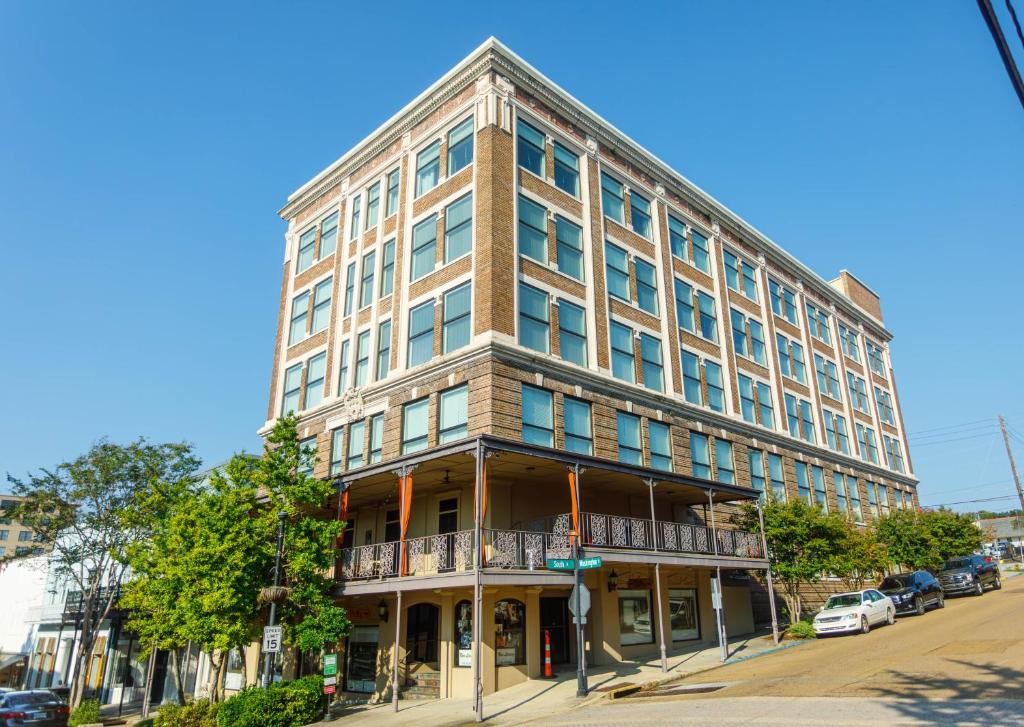 a tall building on the corner of a street at The Valley in Vicksburg