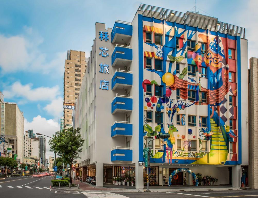 a building with a mural on the side of it at Legend Hotel Kaohsiung Pier2 in Kaohsiung