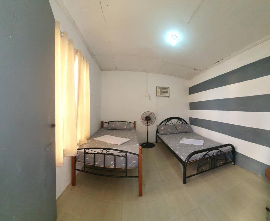 Postel nebo postele na pokoji v ubytování Kantil Dive Resort