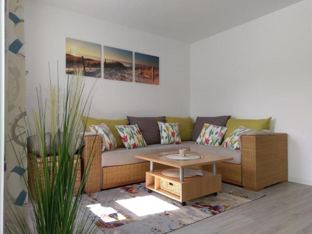 a living room with a couch and a coffee table at Windspiel in Schönberg