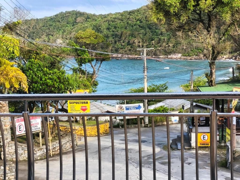 a view of the ocean from a balcony at Pousada Mirante do César in Bombinhas