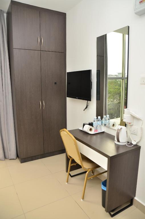 TV a/nebo společenská místnost v ubytování D'Metro Hotel
