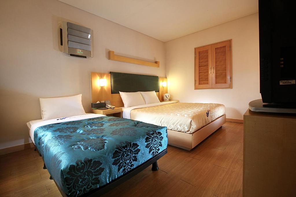 Postel nebo postele na pokoji v ubytování Incheon Airporthotel Airstay